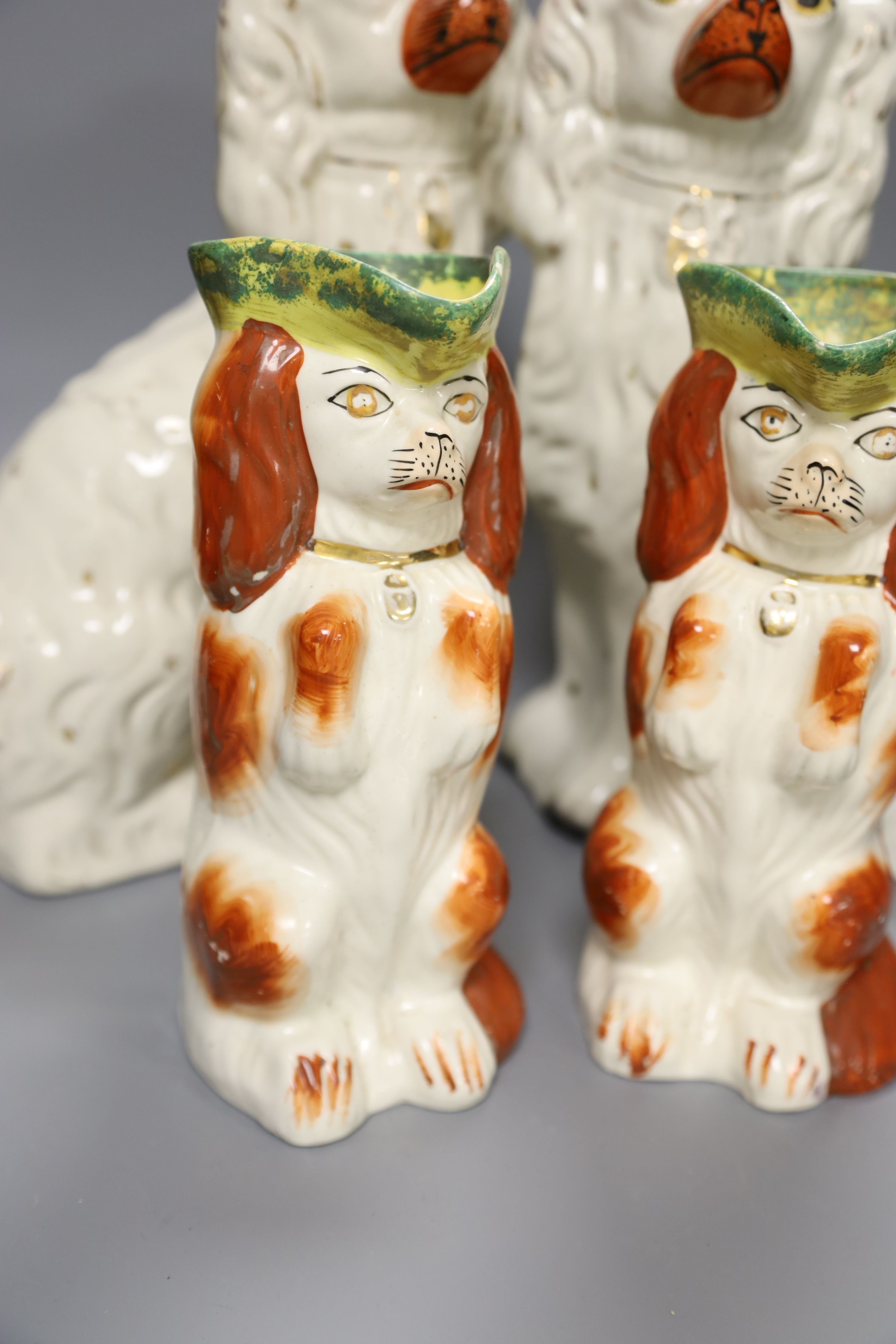 Two pairs of 19th century Staffordshire King Charles Spaniels, height 31cm